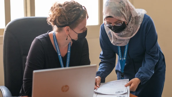 Two teachers working at desk