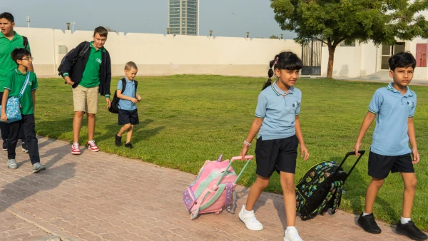 students arriving at The WellSpring Private School about to get ready for school