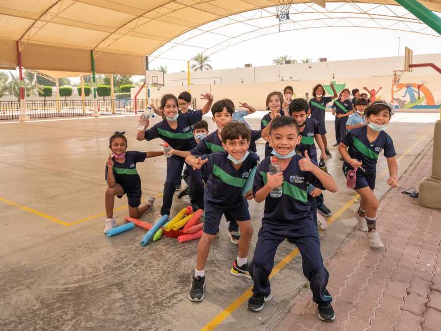 the wellspring private school about our values and history with students outside on the basketball court