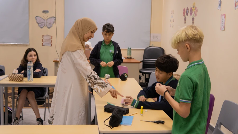 The WellSpring Private School, Ras Al Khaimah teacher and students in class