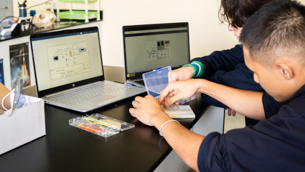 The WellSpring Private School, Ras Al Khaimah students working with electronics on their laptops